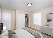 Thumbnail 43 of 45 - a bedroom with a bed and a dresser and a window at Tradewinds, Windcrest