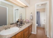 Thumbnail 44 of 45 - a bathroom with a sink and a mirror at Tradewinds, Windcrest, TX
