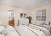 Thumbnail 45 of 45 - a bedroom with a bed and a dresser and a window at Tradewinds, Windcrest, TX, 78239