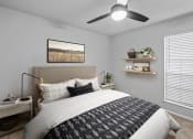 Thumbnail 7 of 47 - a bedroom with a ceiling fan and a window with a blind  at Carmel at Deerfield, San Antonio, Texas