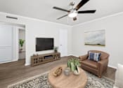 Thumbnail 8 of 79 - a living room with a ceiling fan and a couch  at Sunset Heights, Texas