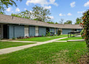 Thumbnail 30 of 79 - a blue building with a picnic table in front of it  at Sunset Heights, San Antonio, Texas