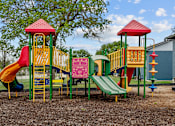 Thumbnail 28 of 79 - a colorful playground with slides and climbers  at Sunset Heights, Texas