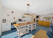 Thumbnail 22 of 40 - kitchen with a long table at Crosspoint Oaks at Boerne, Boerne, TX 78006
