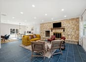 Thumbnail 19 of 40 - living room with a stone fireplace at Crosspoint Oaks at Boerne, Texas