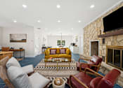 Thumbnail 20 of 40 - living room with a stone fireplace at Crosspoint Oaks at Boerne, Texas, 78006