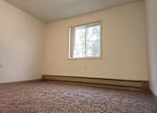 Thumbnail 5 of 15 - an empty room with a window in it