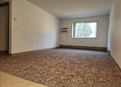 Thumbnail 2 of 15 - the living room of an empty house with a window