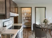 Thumbnail 4 of 54 - a kitchen and dining area leading to a pantry