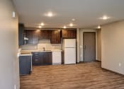 Thumbnail 23 of 54 - a kitchen with a white refrigerator freezer next to a stove top oven
