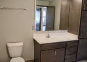 Thumbnail 42 of 54 - a bathroom with a toilet sink and mirror