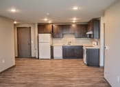 Thumbnail 22 of 54 - a kitchen with a white refrigerator freezer next to a dishwasher