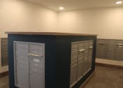 Thumbnail 53 of 54 - a view of the mail room in a building with mailboxes and filing cabinets