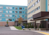 Thumbnail 2 of 54 - a view of the outside of an apartment building and a parking lot