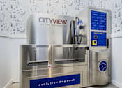 Thumbnail 20 of 29 - A machine with a blue label that says "evolution dog wash" is in front of a wall with a pattern of dog paw prints.