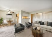 Thumbnail 1 of 8 - a living room with a couch and a table