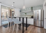 Thumbnail 9 of 15 - Community Room Kitchen Area