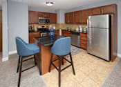Thumbnail 2 of 13 - A kitchen with a table and two chairs.