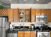 Thumbnail 10 of 29 - Custom Finishing Packages that include Quartz Countertops, Maple Cabinetry and Stainless-Steel Whirlpool Appliances.