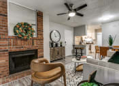 Thumbnail 4 of 16 - Brick Fireplace and ceiling fan