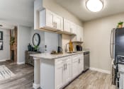 Thumbnail 9 of 16 - our redesigned kitchen is open to the living room and dining room