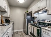 Thumbnail 5 of 16 - an updated kitchen with stainless steel appliances.