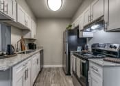 Thumbnail 11 of 16 - enjoy a modern kitchen with stainless steel appliances and granite counter tops