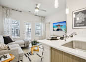 Thumbnail 13 of 140 - Open concept living room and kitchen at Matador Apartments, Austin, Texas