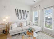 Thumbnail 48 of 116 - A white couch with a glass table in front of it. at Park South Apartments, Austin