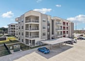 Thumbnail 94 of 103 - Modern apartment building with covered parking at Cantarra Apartments, Manor
