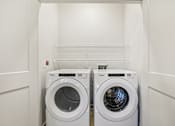 Thumbnail 117 of 140 - Inunit laundry with stacked wire shelving at Matador Apartments, Austin