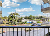 Thumbnail 119 of 140 - Balcony view overlooking parking and neighborhood at Matador Apartments, Texas, 78745
