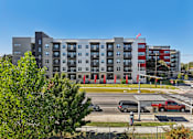 Thumbnail 89 of 140 - Modern apartment building exterior with street view at Matador Apartments, Austin, TX 78745