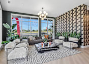 Thumbnail 71 of 127 - A living room with a black and white patterned wall and a large window.