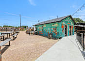 Thumbnail 91 of 116 - A mural on a building is painted in bright colors. at Park South Apartments, Texas, 78748