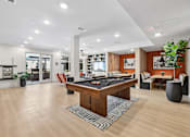Thumbnail 81 of 127 - A room with a pool table and a sofa.