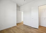 Thumbnail 132 of 140 - Spacious bedroom with walk-in closet and wood floors at Matador Apartments, Texas, 78745