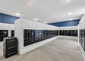 Thumbnail 85 of 127 - A room with a long row of black filing cabinets.