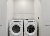 Thumbnail 137 of 140 - Laundry room with front load washer and dryer 1 at Matador Apartments, Austin, TX 78745