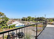 Thumbnail 138 of 140 - Outdoor balcony with street and neighborhood views at Matador Apartments, Austin, TX