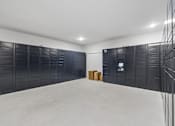 Thumbnail 92 of 127 - A room with a white ceiling and black storage units.