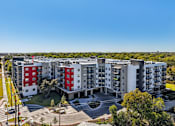 Thumbnail 1 of 140 - Modern apartment community aerial view with courtyards at Matador Apartments, Austin