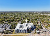 Thumbnail 92 of 140 - Aerial view of modern apartment complex with rooftop amenities at Matador Apartments, Austin, Texas