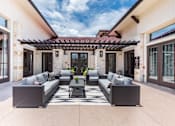 Thumbnail 23 of 59 - a patio with couches and a coffee table under a pergola at Avery Ranch, Texas