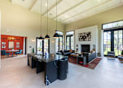 Thumbnail 4 of 59 - a kitchen and living room with a large black island with a granite countertop at Avery Ranch, Austin