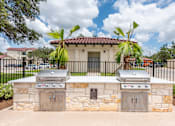 Thumbnail 35 of 59 - two bbq grills in front of a house with palm trees at Avery Ranch, Austin, Texas