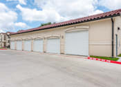 Thumbnail 40 of 59 - a row of three garage doors on the side of a building at Avery Ranch, Texas, 78717