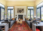 Thumbnail 5 of 59 - a living room with a fireplace and large windows at Avery Ranch, Austin Texas