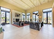 Thumbnail 7 of 59 - a large open living room with a fireplace and a large kitchen with a large island at Avery Ranch, Austin, 78717