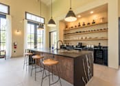 Thumbnail 8 of 59 - a kitchen with an island and stools at Avery Ranch, Austin, Texas